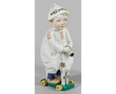 "Knabe auf Holzpferd" aus der Serie der sog. Hentschelkinder Auf einem Holzpferd mit Rollen sitzender, kleiner Junge in lange