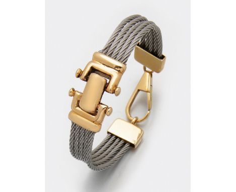 Sportiver Armreif von WEMPE Stahl, teilw. Gelbgold, gest. 750. Armband aus Edelstahlseilen und Goldelementen. Herstellerzeich