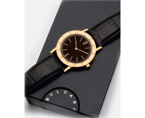 Herren-Armbanduhr von BVLGARI-"BVLGARI-BVLGARI" Gelbgold, gest. 750. Rundes Uhrengehäuse, Lunette mit graviertem Schriftzug "