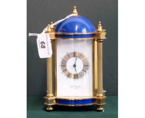 A gilt brass and blue enamel carriage clock, the dial signed Du Chateau, the bell striking movement in a four panelled glass 