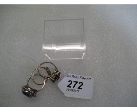 A three stone diamond ring, together with two further rings.