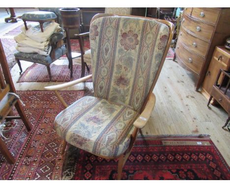 An Ercol stick back armchair, 73cm wide.