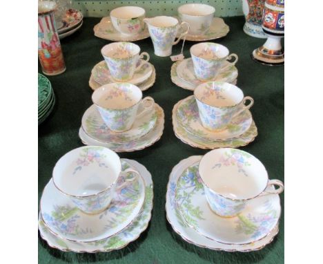 A Wellington bone china part-tea service, comprising: six trios, two sugar bowls, two square plates and a milk jug.