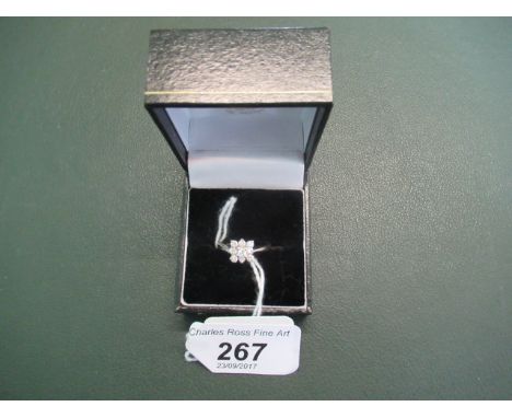 A diamond cluster ring, the square shaped brilliant cut claw mounted diamond cluster, to plain 18ct white gold shank.