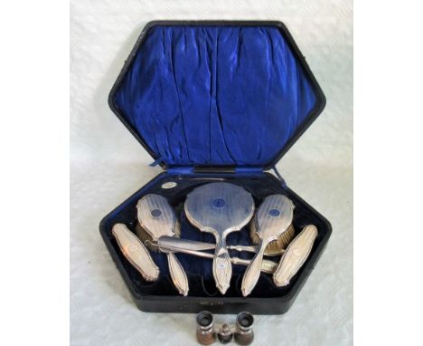 A cased six piece dressing table set, having engine turned silver backs, together with a pair of opera glasses.