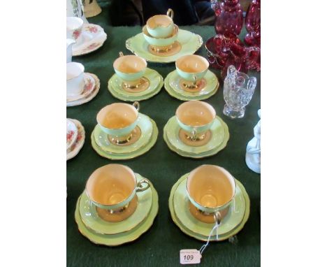 A 'Queen Anne' fine bone china part-tea service, comprising: six trios, sandwich plate, open sugar bowl and milk jug, having 