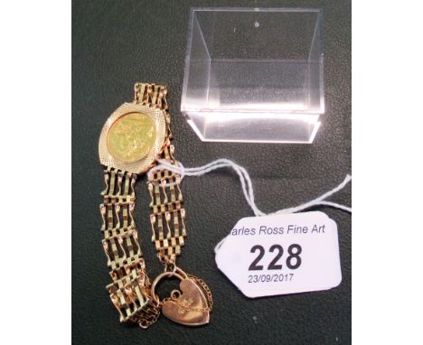 A Queen Elizabeth II half sovereign, dated 1982, to a 9ct gold gate link bracelet with heart locket.