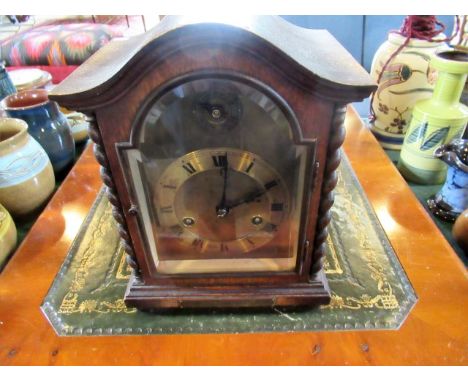 An oak cased bracket clock, the gilt dial bearing Roman numerals, eight day coil striking movement, bearing presentation plaq