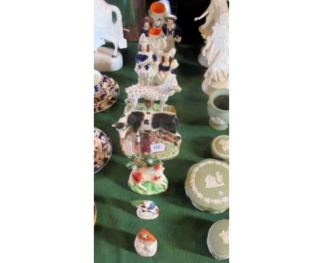 A collection of seven Staffordshire ceramic figures, to include animals, a pair of stem vases and others, the tallest 22cm.