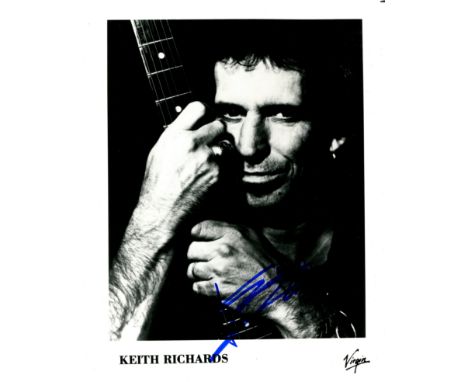 RICHARDS KEITH: (1943- ) English Guitarist and Singer. Best known as founding member of the rock band The Rolling Stones. Sig