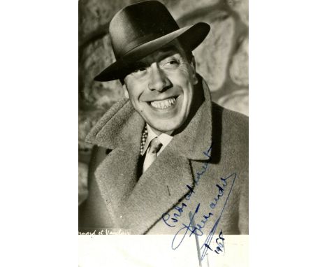 FERNANDEL: (1903-1971) French actor and singer. Vintage signed postcard photograph of Fernandel in a smiling head and shoulde