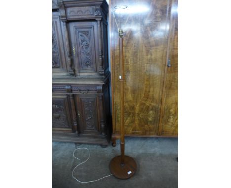 A teak standard lamp 