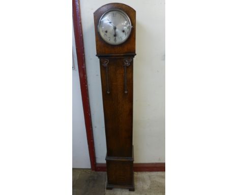 An early 20th Century oak dwarf longcase clock 