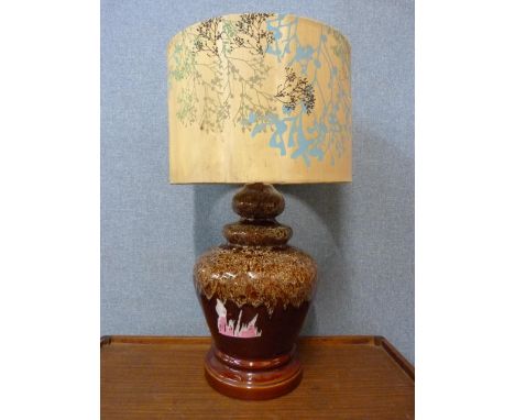 A glazed pottery table lamp 