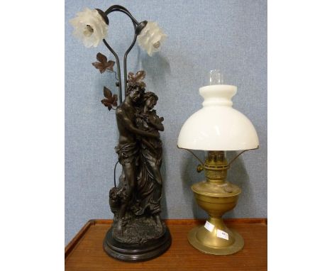 A brass oil lamp and an Art Nouveau style lamp 