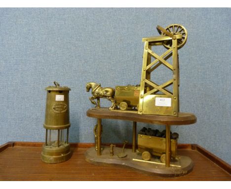 A miner's lamp and a brass colliery model 