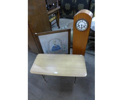 A vintage coffee table, a dwarf longcase clock and an embroidered oak firescreen 