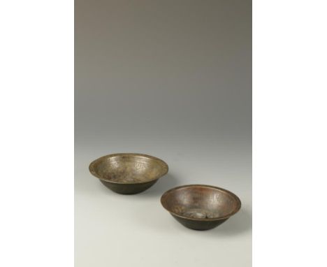 TWO ISLAMIC 'MAGIC' BOWLS, decorated with calligraphy, early/mid 20th century, the largest 5.25" (2)