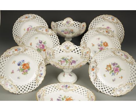 A MEISSEN PORCELAIN TEA SERVICE with moulded basket weave and pierced borders, decorated with floral decoration and gilt cart