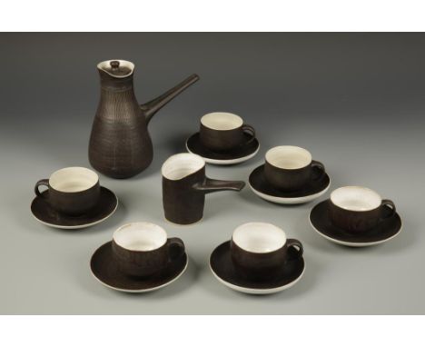 LUCIE RIE (1902-1995) A coffee set with overall brown glazed ground, the coffee pot incised with vertical line patterns, comp
