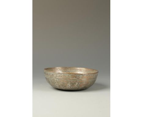 AN ISLAMIC SILVERED BOWL, decorated with calligraphy and numerous figured panels, late 19th/early 20th century, 6.25" dia. 