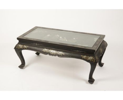 A CHINOISERIE OCCASIONAL TABLE, the rectangular glazed top set with a relief carved scene inset with carved sections of 'jade