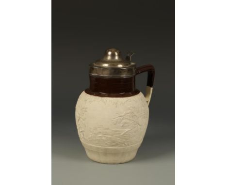 A STONEWARE JUG with an unglazed body decorated in relief with a hunting scene, with figures on horseback, a brown glazed rim