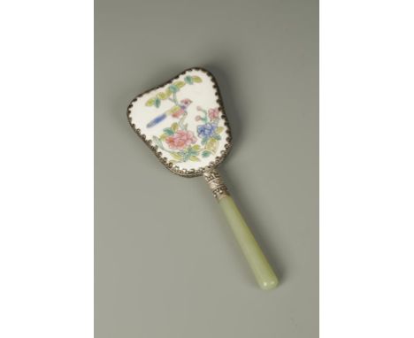 A SMALL CHINESE HAND MIRROR, with a celadon jade handle and enamelled porcelain back, Republic period, 5.75" long
