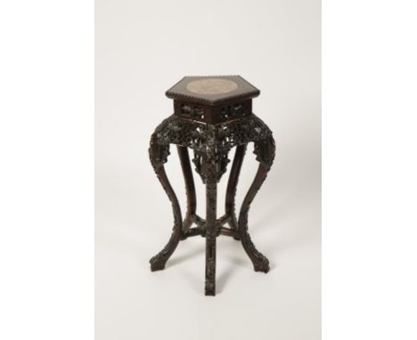 A CHINESE HARDWOOD STAND OR OCCASIONAL TABLE with a pentagonal top with central marble stand on an outswept pierced and carve