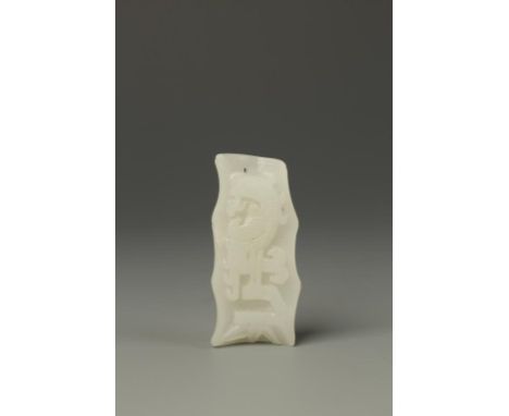 A CHINESE WHITE JADE BAMBOO-FORM PENDANT, the interior carved with a phoenix, late Qing, 2" long