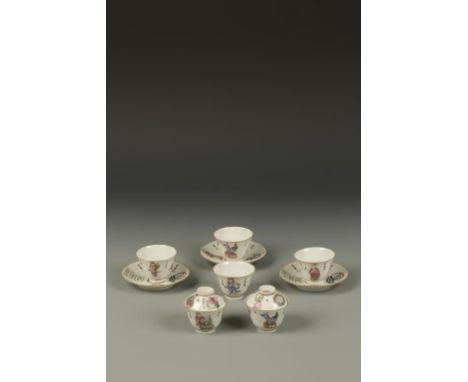 SIX CHINESE FAMILLE ROSE CUPS AND THREE SAUCERS, decorated with Immortals and calligraphy panels, Qianlong marks, 19th centur