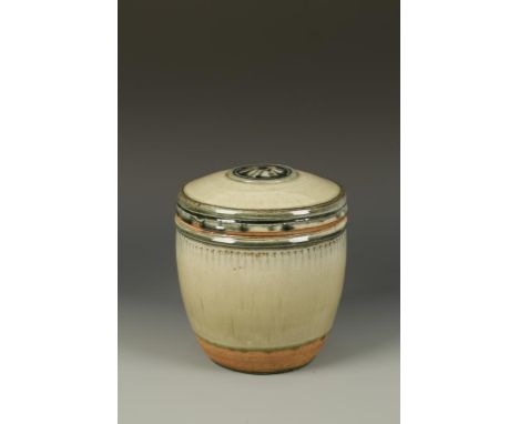 RICHARD BATTERHAM (b.1936) A STONEWARE STORAGE JAR and cover, celadon glazed with incised decoration and wheel to the cover, 
