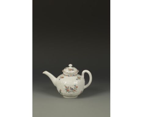 AN EARLY WORCESTER TEAPOT AND COVER painted in Chinese famille verte pallet with birds on flowering branches, within scroll m