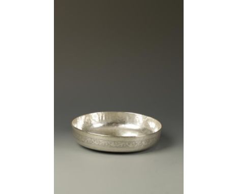 AN ISLAMIC SILVER SHALLOW BOWL, decorated with calligraphy, late 19th/early 20th century, 8.5" dia.