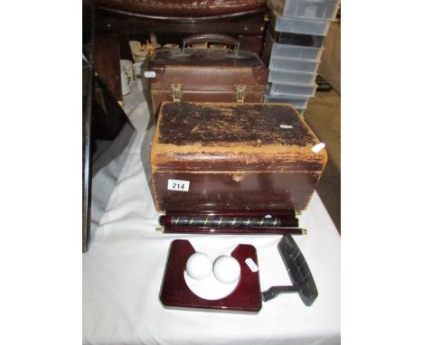 A Wooden box, a case and a golfing item