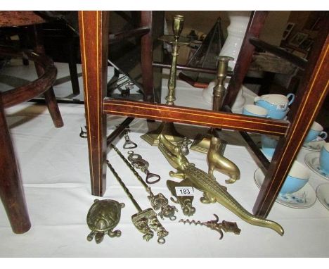 A mixed lot of old brass ware including nut cracker, candlesticks, toasting forks etc