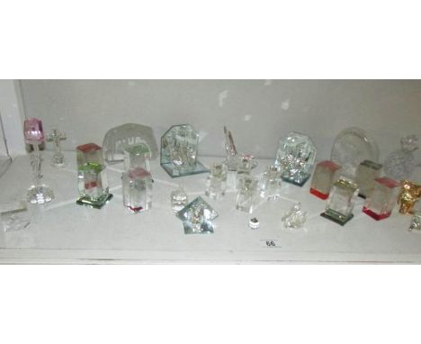A shelf of glass and other ornaments