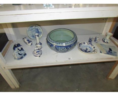 A blue and white planter and a quantity of blue and white Delft pottery