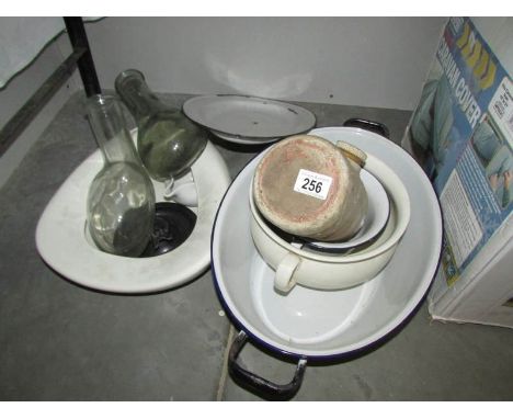 A mixed lot of enamel bowls, hot water bottle etc