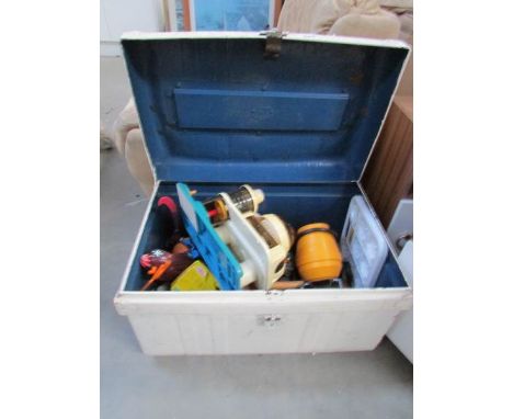 An old tin trunk containing mainly plastic toys