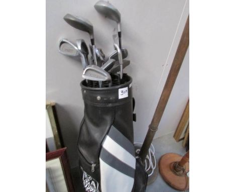 A set of Howson golf clubs and golf bag