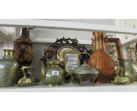 A shelf of miscellaneous including wall clock, metal ware etc