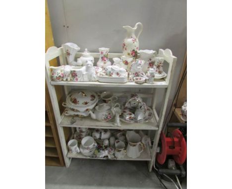 A white painted folding book shelf