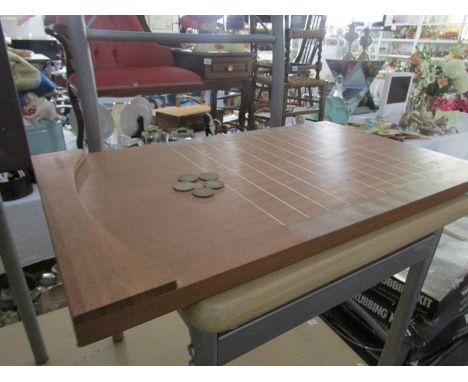 A Shove ha'penny board and a bagatelle