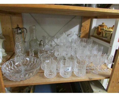 A shelf of assorted glass ware