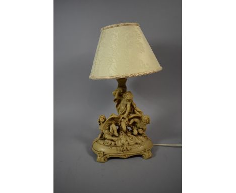 A Moulded Composition Figural Table Lamp and Shade, 45cms High 