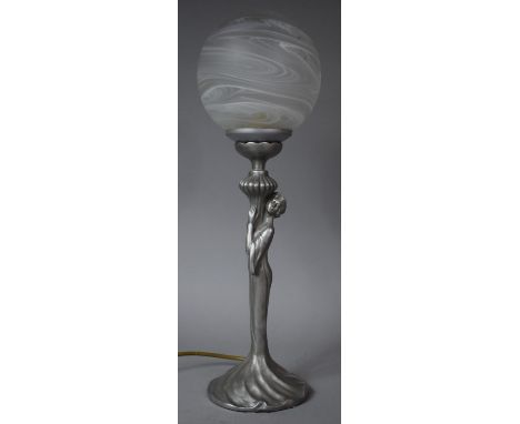 A Modern Figural Table Lamp with Opaque Globe Shade, 47cms High 