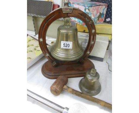 A bell on stand with knocker and small bell