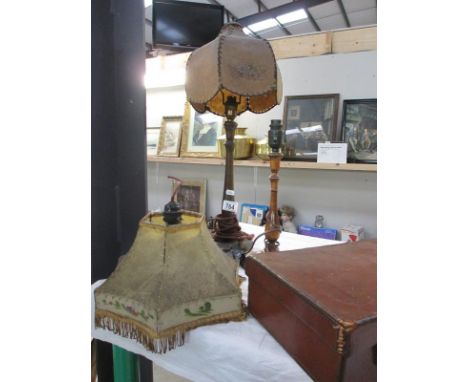 A c1940s wooden table lamp with plastic shade, a ceiling light with plastic shade and another vintage wooden lamp base