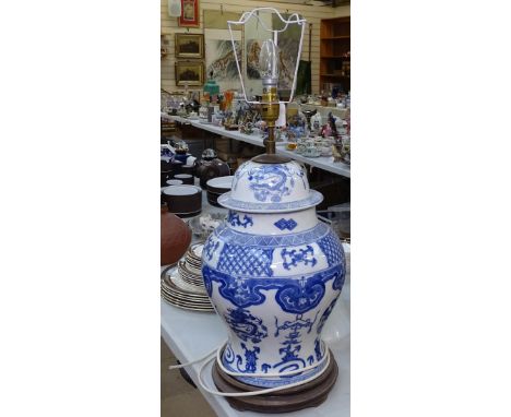 An Oriental table lamp, height 67cm overall, and a milk glass lampshade 